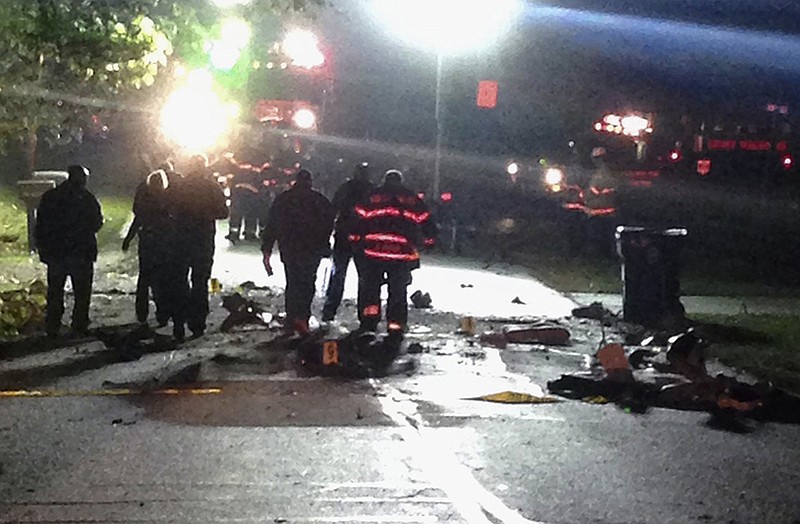 Emergency personnel work the scene of a small plane crash in the Chicago suburb of Palos Hills, Ill.