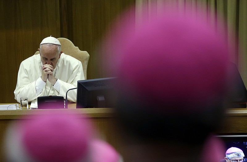 Pope Francis attends a morning session of a two-week synod on family issues at the Vatican.
