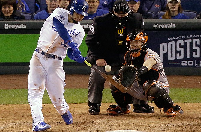 Kansas City Royals' Eric Hosmer hits a single during the fourth inning of Game 3 of the American League baseball championship series against the Baltimore Orioles Tuesday, Oct. 14, 2014, in Kansas City, Mo. 