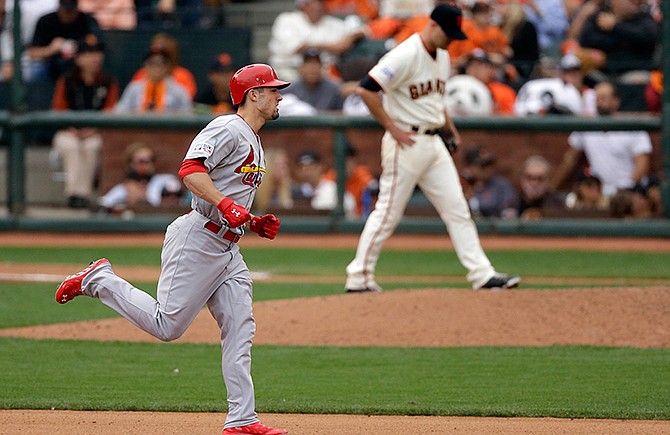 St. Louis Cardinals' Randal Grichuk rounds the bases after a home run off San Francisco Giants starting pitcher Tim Hudson during the seventh inning of Game 3 of the National League baseball championship series Tuesday, Oct. 14, 2014, in San Francisco.