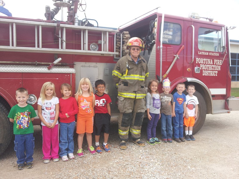 Volunteer firefighter Paul Cary took the fire truck to Latham school for the kindergarten class to see during Fire Prevention Week.