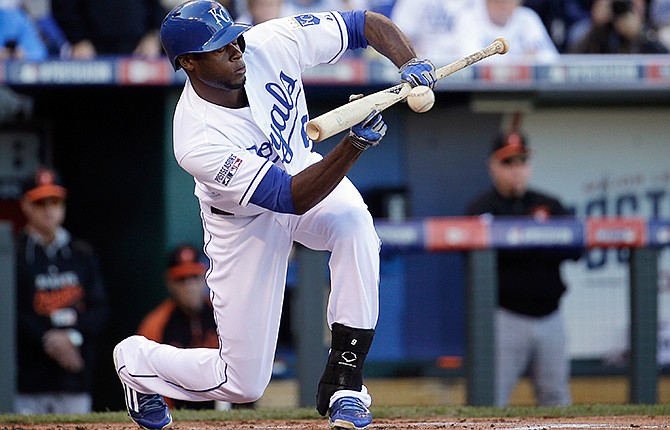 Kansas City Royals' Lorenzo Cain lays down a sacrifice bunt during the first inning of Game 4 of the American League baseball championship series against the Baltimore Orioles Wednesday, Oct. 15, 2014, in Kansas City, Mo. 