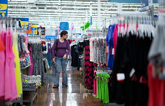 In this June 5, 2014 photo, Chelsea Vick shops for clothes at Wal-Mart Supercenter in Rogers, Ark.