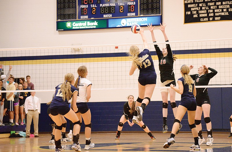 Mary Wehmeyer of Jefferson City tries to defend a hit from Suzie Kuensting of Helias during Tuesday's match between the Lady Jays and Lady Crusaders at Rackers Fieldhouse. 
Helias defeated Jefferson City two sets.