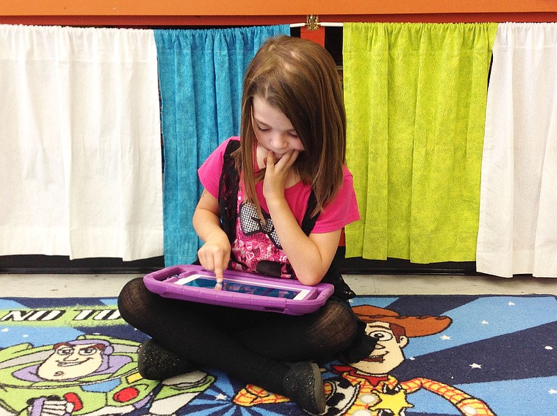 A student in North Elementary School in Holts Summit uses on of her classroom's new iPads. Through a U.S. Cellular grant, the school's kindergarten class received two new iPads, upping the amount the class has to seven.