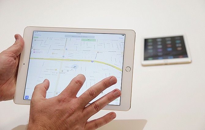 The iPad Air 2 is demonstrated at Apple headquarters on Thursday, Oct. 16, 2014 in Cupertino, Calif.