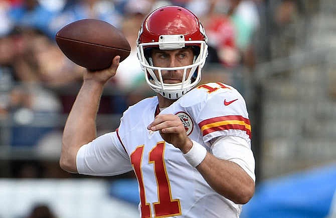 Kansas City Chiefs quarterback Alex Smith looks to throw a pass against the San Diego Chargers during the second half of an NFL football game, Sunday, Oct. 19, 2014, in San Diego. 