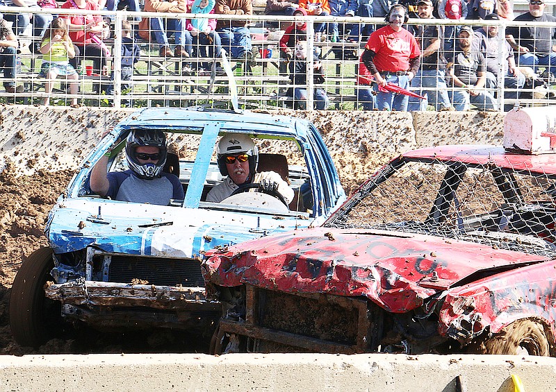 Two cars collide during the figure 8 and demolition derby Saturday. The Fulton Jaycees along with Timbrook Motorsports put on the Fourth Annual Graveyard Smash.