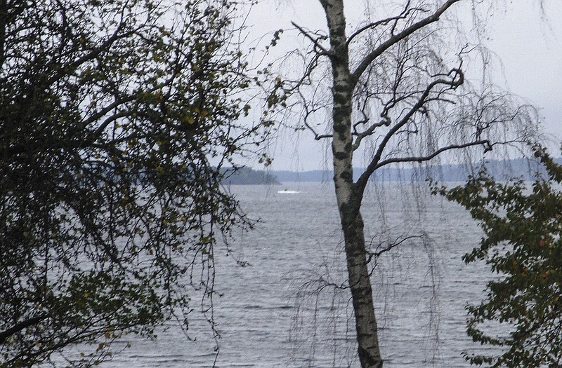 In this amateur photo provided by Sweden's armed forces and distributed by the TT News Agency on Sunday, a partially submerged object is visible in the water at center, in the Stockholm archipelago, Sweden. The Swedish military said Sunday it had made three credible sightings of foreign undersea activity in its waters during the past few days amid reports of a suspected Russian intrusion in the area. 