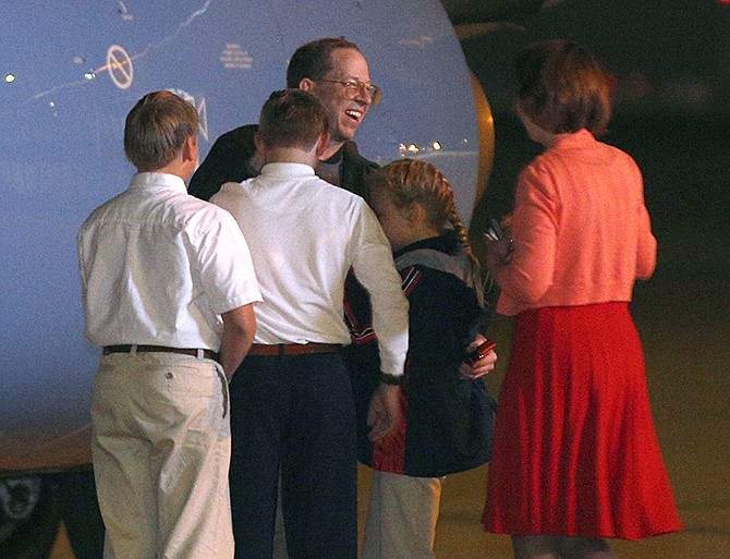 Jeffrey Fowle is greeted by family members upon his arrival, early Wednesday, at Wright-Patterson Air Force Base, Ohio. Fowle was detained for nearly half a year in North Korea after leaving a Bible at a nightclub. Christian evangelism is considered a crime in North Korea.