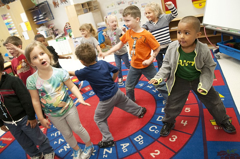 Fulton Education Center students in Linda Hall's class stop in place during a dance-and-freeze song Thursday. The school is registering students for a new preschool program, which will start in November. Funding that's supporting the program came from the Missouri Department of Elementary and Secondary Education grant for $110,000.