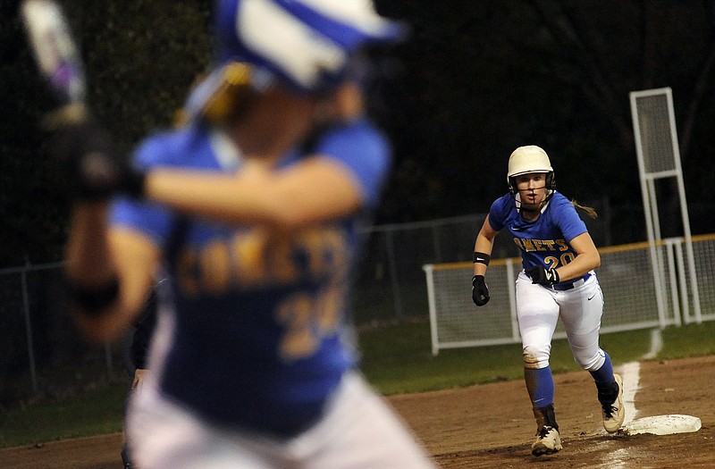 Fatima's Sammey Bunch gets a jump from third base as Makayla Buscher stands in at the plate during a game this season in Westphalia.