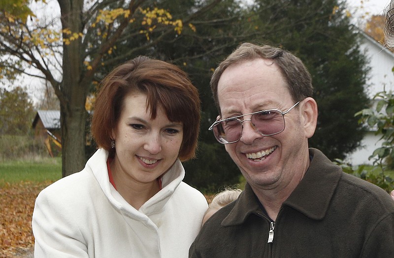 Jeffrey Fowle, right, stands with his wife Tatyana Fowle at their home in West Carrollton, Ohio.