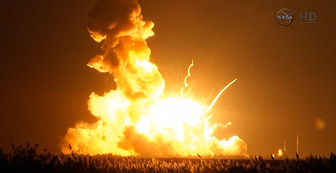 This image taken from video provided by NASA TV shows Orbital Sciences Corp.'s unmanned rocket blowing up over the launch complex at Wallops Island, Va., just six seconds after liftoff. The company says no one was believed to be hurt and the damage appeared to be limited to the facilities.