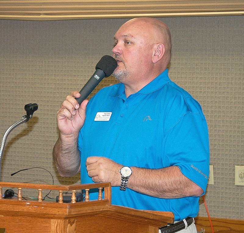 Todd Carlton, Ducks Unlimited Eastern District Region Director, makes announcements at the annual dinner meeting of the Moniteau County Chapter of Ducks Unlimited. The meeting was at the Knights of Columbus Hall, Tipton.