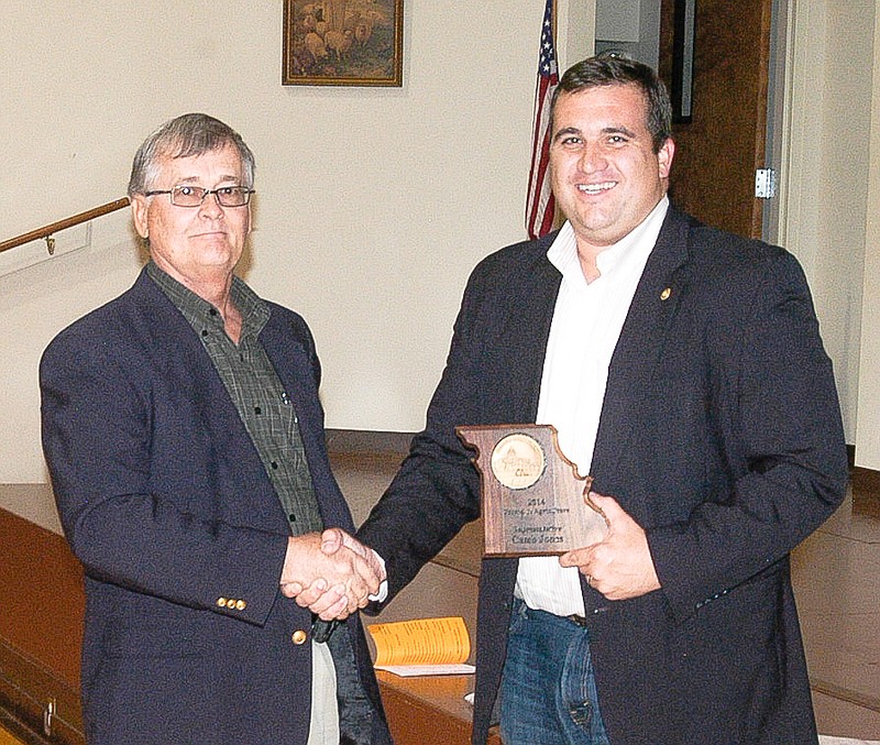 Moniteau County Farm Bureau President Dennis Feezor, left, presents a "Friend of Agriculture Award" to Rep. Caleb Jones at the organization's annual meeting, Tuesday, Oct. 21. Jones represents the north part of Moniteau County.