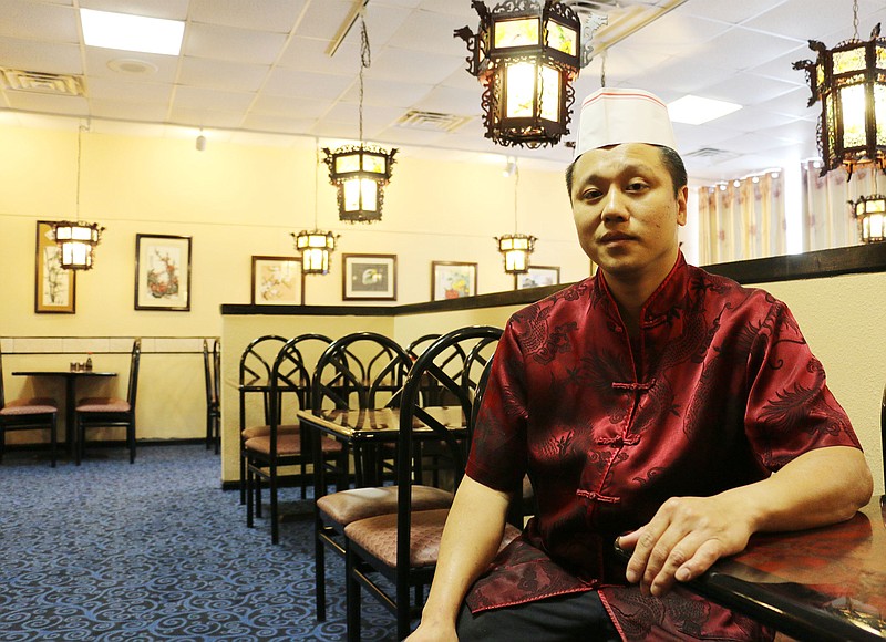Dragon Kitchen owner Andy Ning sits in his newly renovated restaurant Thursday afternoon. The restaurant reopens Friday, Oct. 31 after being closed due to a poor Oct. 15 Fulton health inspection report.