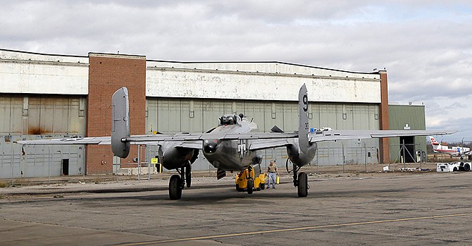 A B-25 bomber, part of the Yankee Air Museum collection, is placed in front of the former Willow Run Bomber Plant in Ypsilanti Township, Mich., Thursday, Oct. 30, 2014. Yankee Air Museum board chairman Ray Hunter, signed papers Thursday making the aviation museum the owner of a 144,000-square-foot slice of the former Willow Run Bomber Plant, where Rose Will Monroe and other workers built B-24 Liberator bombers (not B-25s) during World War II. The signing ceremony represented the culmination of efforts to raise the $8 million needed to save part of the factory for the nearby Yankee Air Museum's new home.