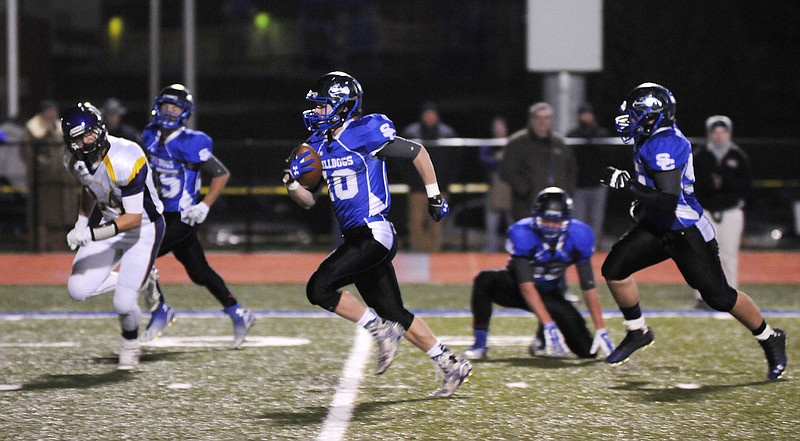 South Callaway senior slot receiver Cory Hanger breaks away on a 74-yard punt return for a touchdown in the first quarter of the third-ranked Bulldogs' 61-0 blitz of Hallsville on Friday night in the Class 2, District 7 semifinals in Mokane. Hanger finished with six touchdowns, including two rushing and two receiving, and also ran back an interception from his free safety position.
