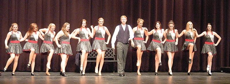 In the musical "Crazy for You," Bobby Childs (Alex Dalbey) leads the Zangler Follies on stage at the theater in Deadrock, Nev., in the 1930s.