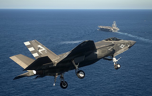 This Monday photo provided by the US Navy shows an F-35C Joint Strike Fighter conduct an approach on the aircraft carrier USS Nimitz, 40 miles off San Diego, California.