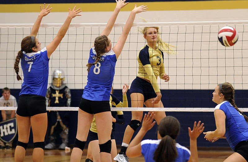 Erica Haslag of Helias finds an opening for a kill during a match this season against Quincy, Ill., at Rackers Fieldhouse.