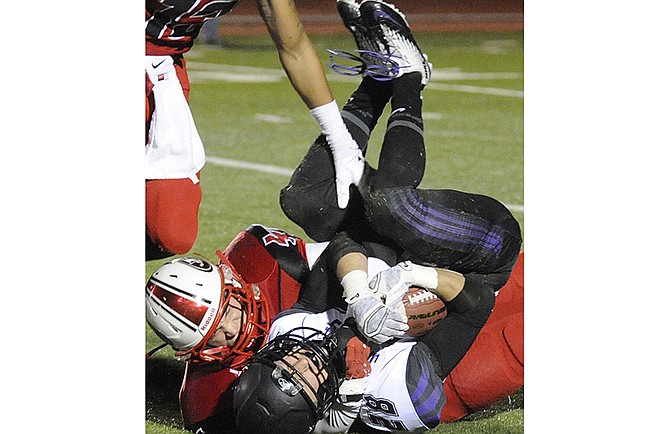 Jefferson City's Adam Weaver brings down Fort Zumwalt West's Nick Young during a return in last week's game at Adkins Stadium.