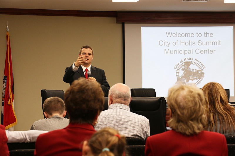 Holts Summit City Administrator Brian Crane discusses the city's new municipal center at the facility's open house Monday night.