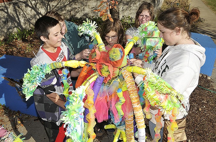 Students in Holley Smothers' art class at Thomas Jefferson Middle School work on one of the flowers that will be installed on the greenway for the Art in the Park program. Students are, from left, Alex Sims, Carol Johnson, Amanda Rybak, Katlyn Johnson and Emily Moeller.