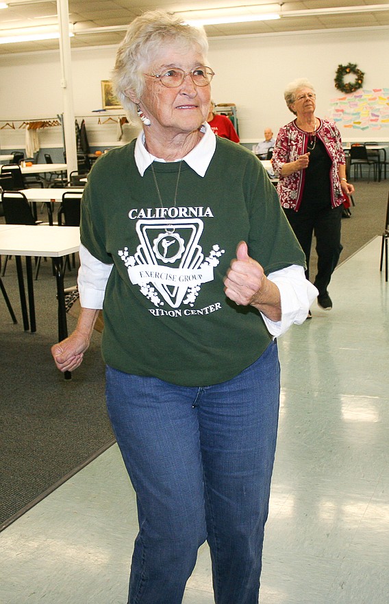 Pat Blecke works on cardio routines during an exercise class Nov. 5 at the California Nutrition Center. Blecke proudly wears her exercise group t-shirt that members typically wear on Wednesdays.