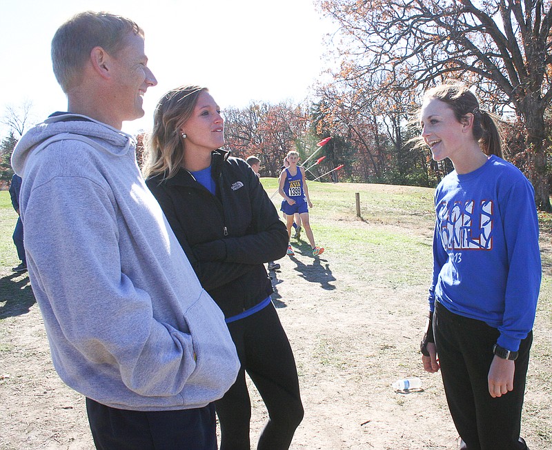 California junior Katie Imhoff (right) talks with her cross country coaches before the Class 2 boys race Saturday at Oak Hills Golf Center in Jefferson City. Imhoff ran in the Class 2 girls race earlier in the day. It was her third straight year to run at the state finals.