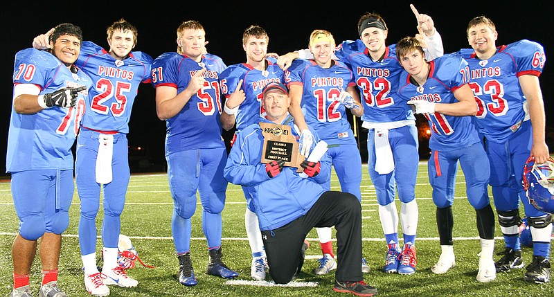 Pintos head coach Marty Albertson (kneeling) shows off his team's Class 3 District 6 championship plaque. California beat rival Blair Oaks 32-30 in a thrilling finish on Friday night. Albertson is joined by seniors (from left) Ramiro Garcia, Drew Norton, Nathan Squires, Jaden Barr, Allan Burger, Dylan Norton, Walker Borghardt and Matt Oerly.