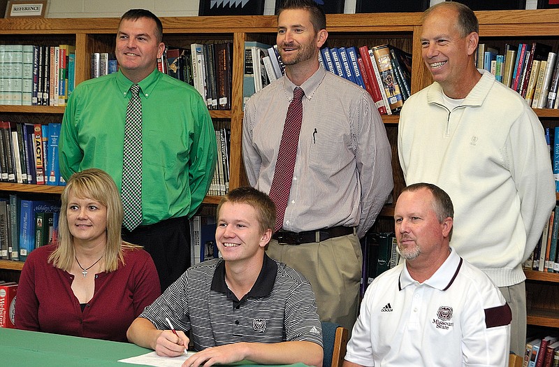 Blair Oaks senior Kory Franks (seated in middle) signed a national letter of intent Wednesday to play golf at Missouri State University. Seated with him are his parents, Angie and David Franks. Standing (from left) is Blair Oaks principal Gary Verslues, athletic director Ryan Fick and coach Leroy Bernskoetter.