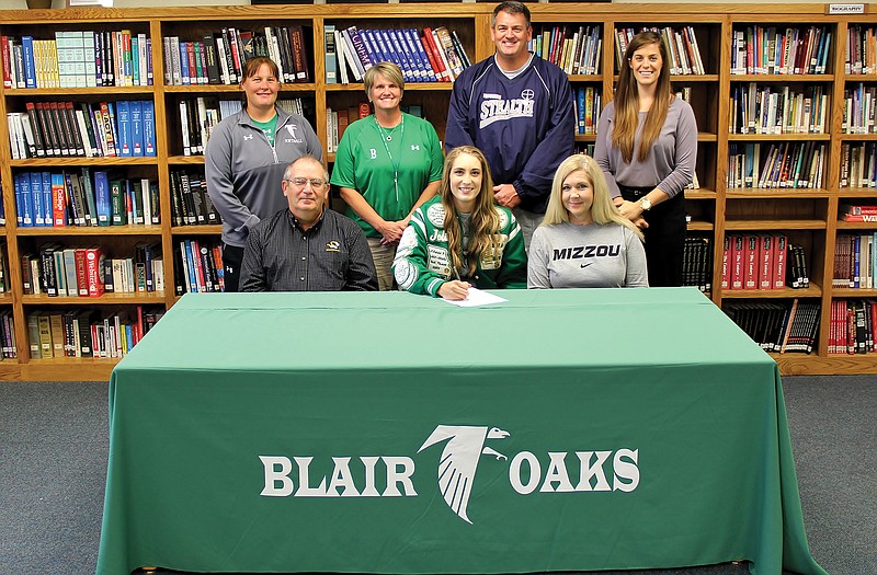 Blair Oaks senior Jolie Duffner signed a national letter of intent Wednesday to play softball at the University of Missouri. Seated with her are her parents, Paul and Sharon Duffner. Standing (from left) is Blair Oaks assistant coach Jill Linnenbrink, head coach Sharon Buschjost, Stealth travel coach Greg Logsdon and Stealth travel coach Cat Lee.