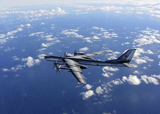 This is an Oct. 29 photo provided by Britain's Royal Air Force of a Russian military long range bomber aircraft photographed by an intercepting RAF quick reaction Typhoon (QRA) as it flies in international airspace.  Russia's defense minister says the military will conduct regular long-range bomber patrols, ranging from the Arctic Ocean to the Caribbean and the Gulf of Mexico. Sergei Shoigu's statement comes as NATO has reported a spike in Russian military flights over the Black, Baltic and North seas as well as the Atlantic Ocean. It reflects Moscow's increasingly tough posture amid tensions with the West over Ukraine.