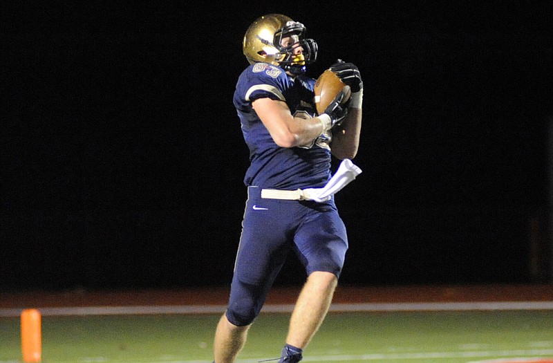 Hale Hentges of Helias leaps for a catch during last Friday night's 47-0 win against Mexico at Adkins Stadium.