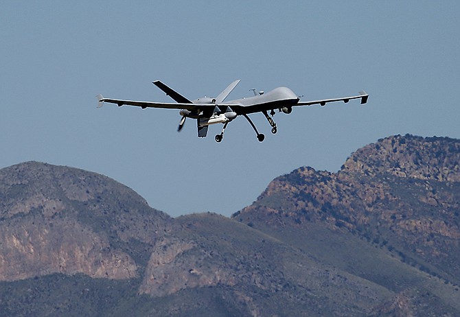 A U.S. Customs and Border Patrol drone aircraft lifts off in September at Ft. Huachuca in Sierra Vista, Arizona. The U.S. government now patrols nearly half the Mexican border by drones alone in a largely unheralded shift to control desolate stretches.