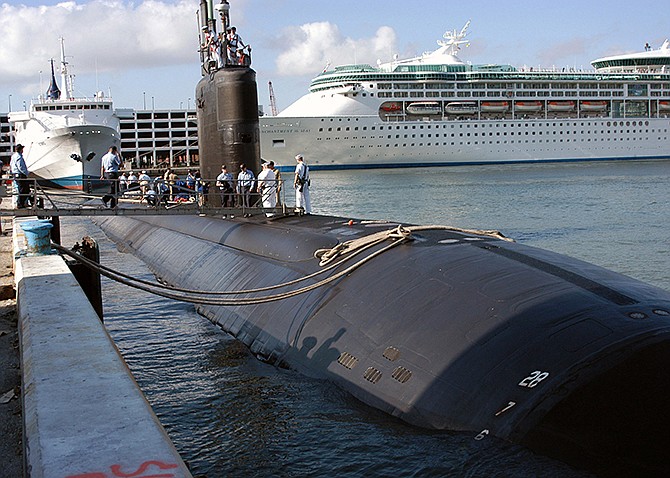 In this 2004 photo provided by the U.S. Navy, the USS Miami (SSN 755) arrives in port, in Fort Lauderdale, Florida. A May 2012 fire that crippled the nuclear submarine at the Portsmouth Naval Shipyard, in Kittery, Maine, showed that the Navy had become complacent about safety in industrial settings and put too much faith in land-based firefighters who had never trained to battle a blaze aboard a submarine, Navy investigators concluded. 