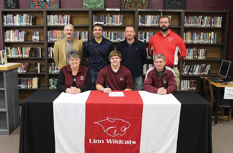Ryan Mantle (seated, center) signed a letter of intent Wednesday to play baseball at Missouri State. Seated with Mantle are his parents, Peggy and Sam Mantle. Standing are (from left) Linn superintendent Shawn Poyser, Linn assistant coach Kevin Hagner, Linn head coach Colby Nilges and Linn athletic director Justin Browning.