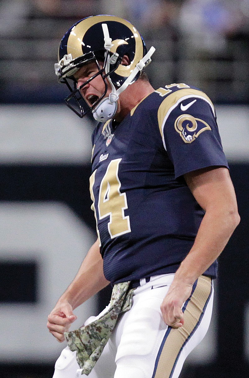 Rams quarterback Shaun Hill celebrates after throwing a 63-yard touchdown pass to wide receiver Kenny Britt during the first quarter of Sunday's game against the Broncos in St. Louis. 