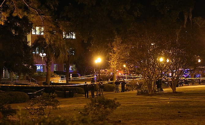 Police investigate a shooting scene at Strozier Library on Florida State campus on Thursday, Nov. 20, 2014, in Tallahassee, Fla. 