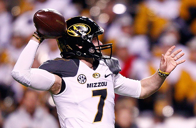 Missouri quarterback Maty Mauk throws to a receiver in the first half of an NCAA college football game against Tennessee, Saturday, Nov. 22, 2014, in Knoxville, Tenn.