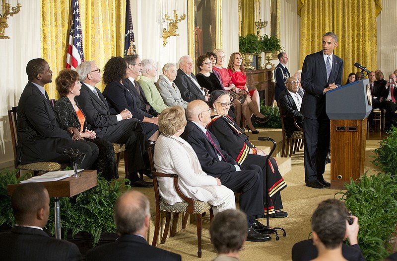 AP
President Barack Obama, right, speaks before awarding the Presidential Medal of Freedom, Monday, Nov. 24, 2014, during a ceremony in the East Room of the White House in Washington. President Obama is presenting the nation's highest civilian honor to 19 artists, activists, public servants and others.