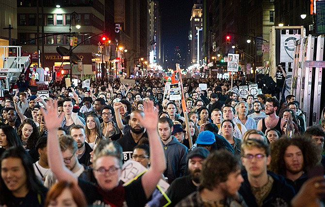 Protestors march up Seventh Avenue towards New York City's Times Square Monday, Nov. 24, 2014 after the announcement of the grand jury decision not to indict police officer Darren Wilson in the fatal shooting of Michael Brown, an unarmed 18-year-old black man.