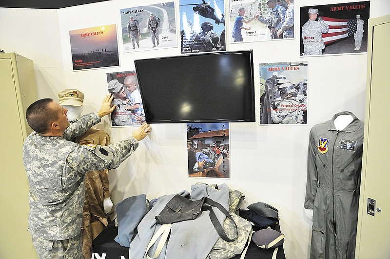 Maj. Alan Brown builds a childrens corner in the Museum of Military History at the Missouri National Guard headquarters. The local museum will serve as the anchor for the newly developed Veterans Trail. The trail includes this museum and more than 40 existing memorials, monuments and grave markers within about a 30-mile radius from Jefferson City.