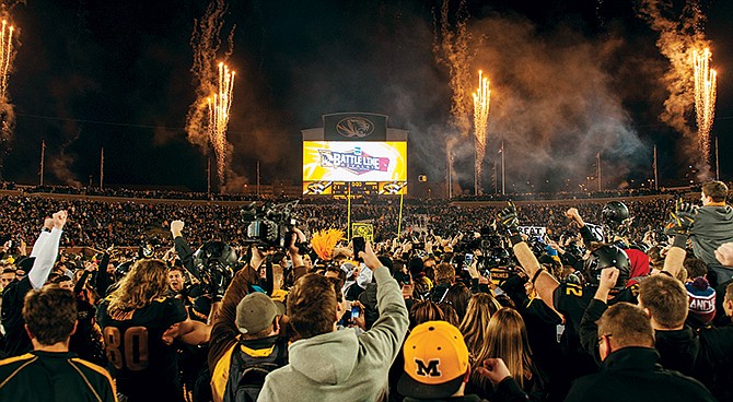 Missouri fans celebrate after the Tigers' 21-14 victory against Arkansas on Friday at Faurot Field. The win clinched the SEC East Division championship for Missouri.