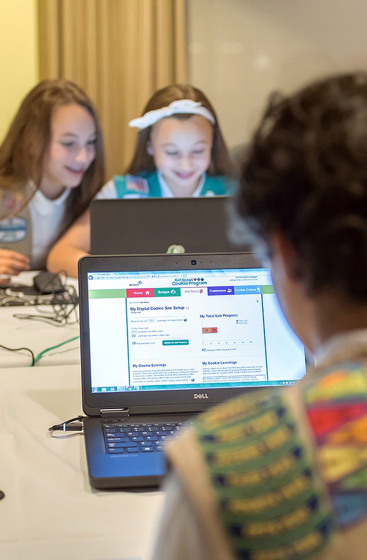 Girl Scouts Olivia and Isabella practice selling cookies on one of two new digital platforms. Its the first time Girls Scouts of the USA has allowed sale of cookies using a mobile app and personalized websites. The Digital Cookie program is intended to enhance, not replace, traditional use of paper spreadsheets.