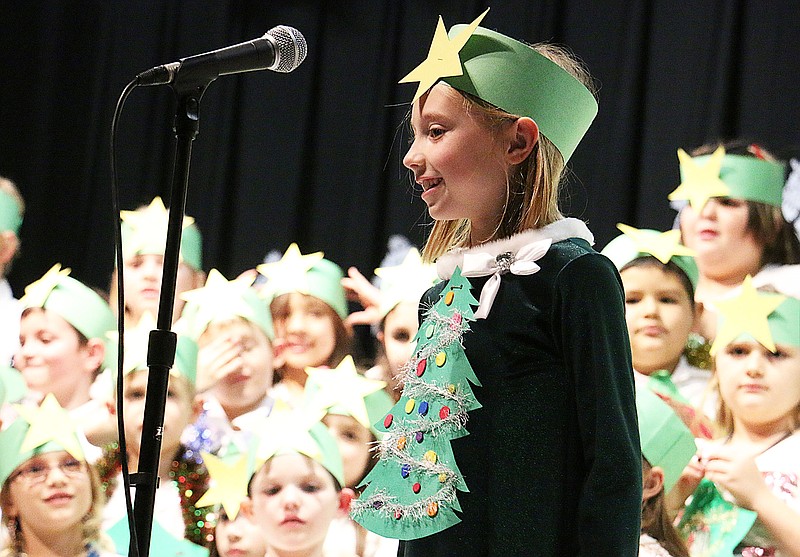 North Elementary second grader Abigail Bruce aka "the littlest Christmas tree" sings what Christmas is all about - caring, happiness, being kind and, more than anything, love.