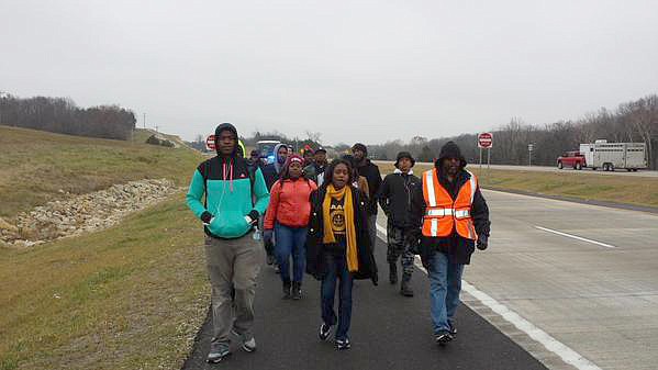"Journey to Justice: Ferguson to Jefferson City" marchers walk along U.S. 50, west of Linn, toward the Capital City on Thursday. The 135-mile march started Saturday in response to the St. Louis County grand jury's decision not to indict former Ferguson police officer Darren Wilson for killing Michael Brown Jr. Marchers are expected to arrive in Jefferson City on Friday.