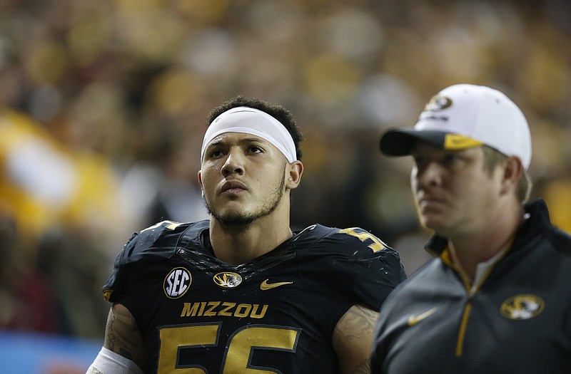 Missouri defensive lineman Shane Ray  walks off the field after being ejected from the game for a late hit against Alabama quarterback Blake Sims during the first half of the Southeastern Conference championship game Saturday in Atlanta.